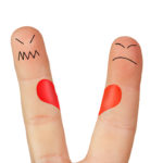 Fingers symbolizing the separation of a couple