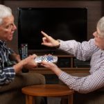Older couple deciding who gets the remote
