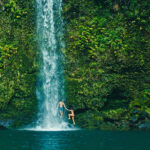 Happily counseled couple at Maui waterfall