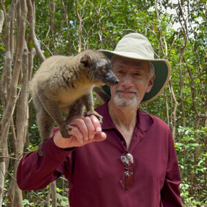 Neil Rosenthal holding a lemur in Madagascar